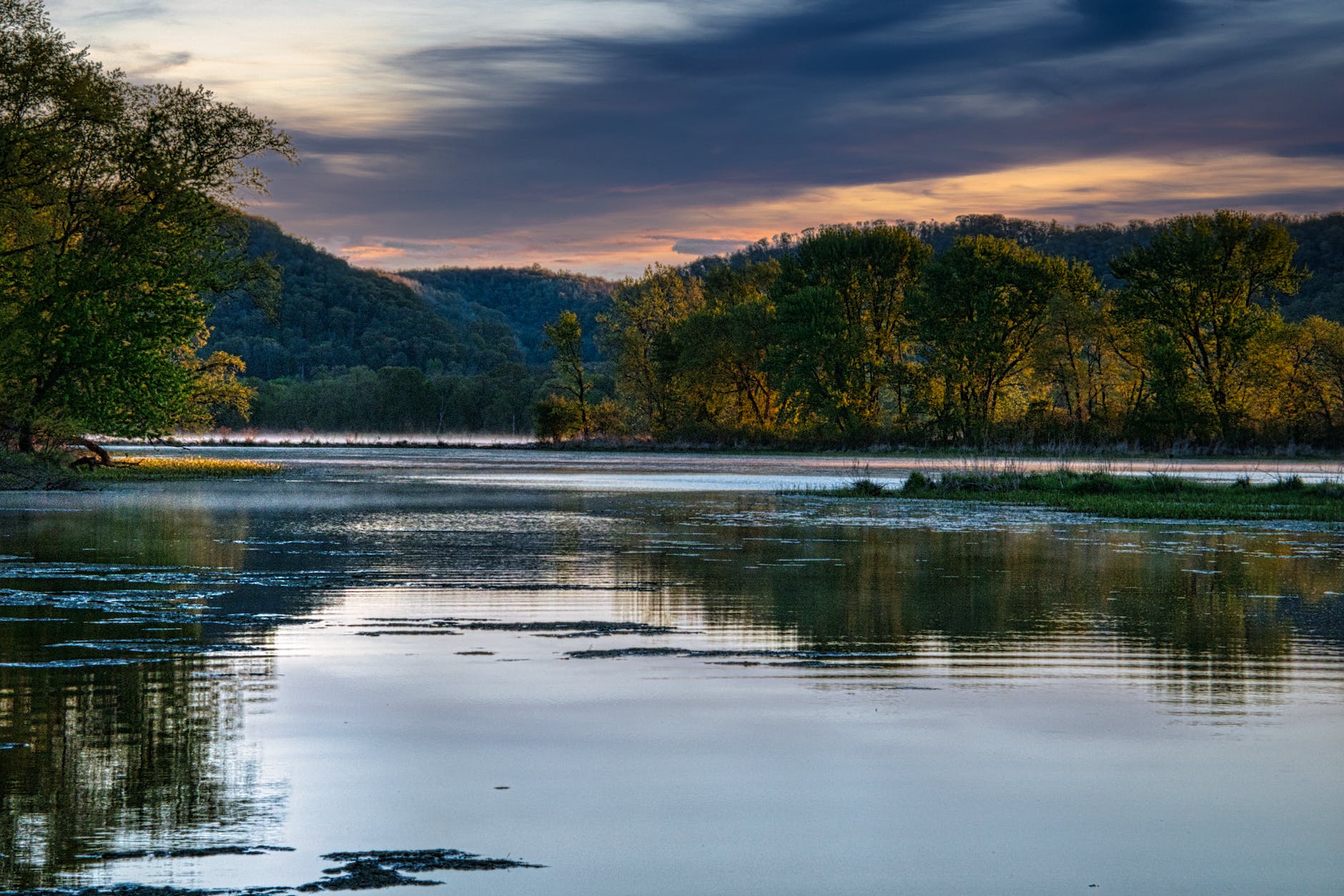 a river under a cloudy sky