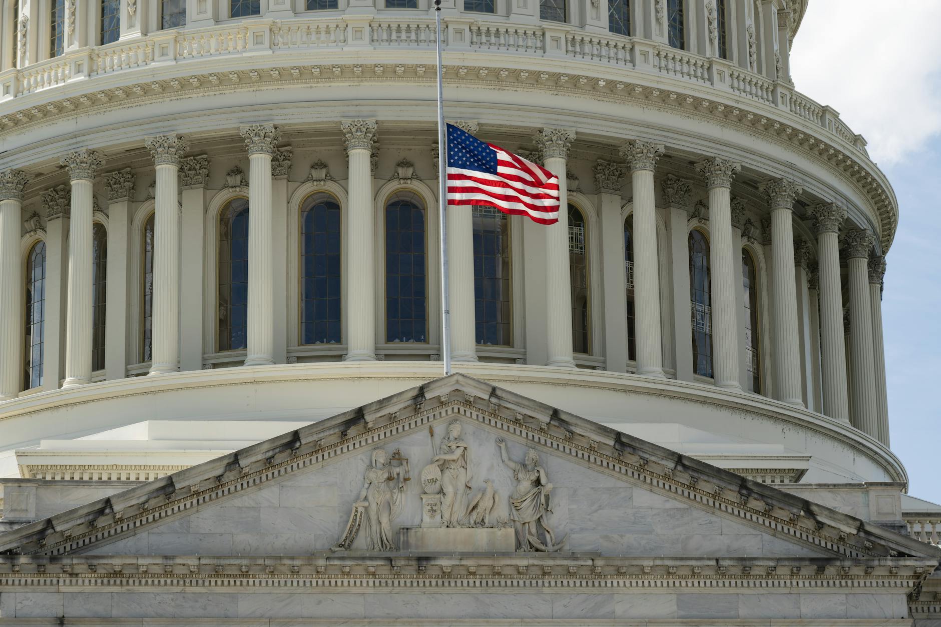 closeup of an administration building with an american flag