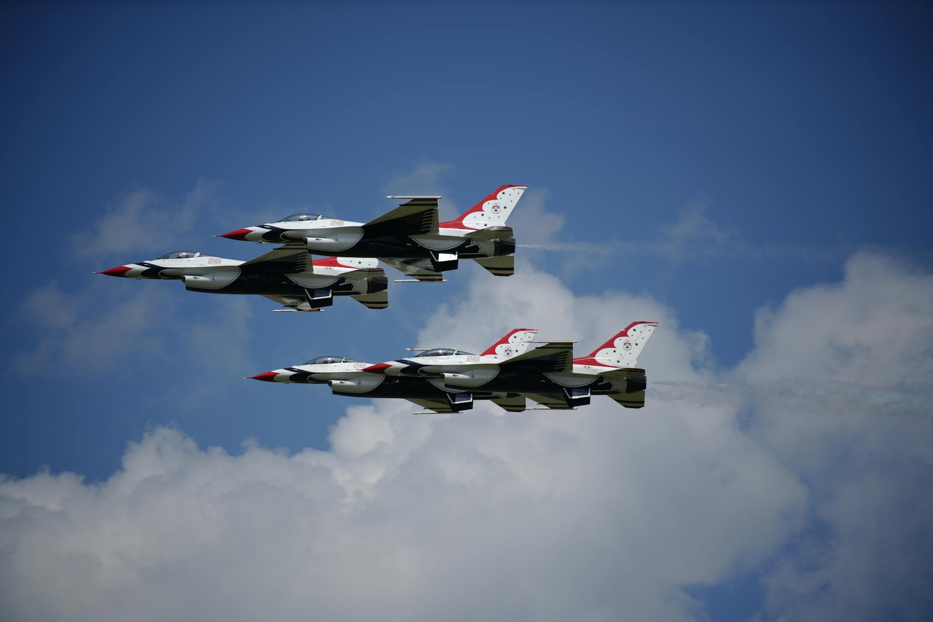 four fighter jets in the sky