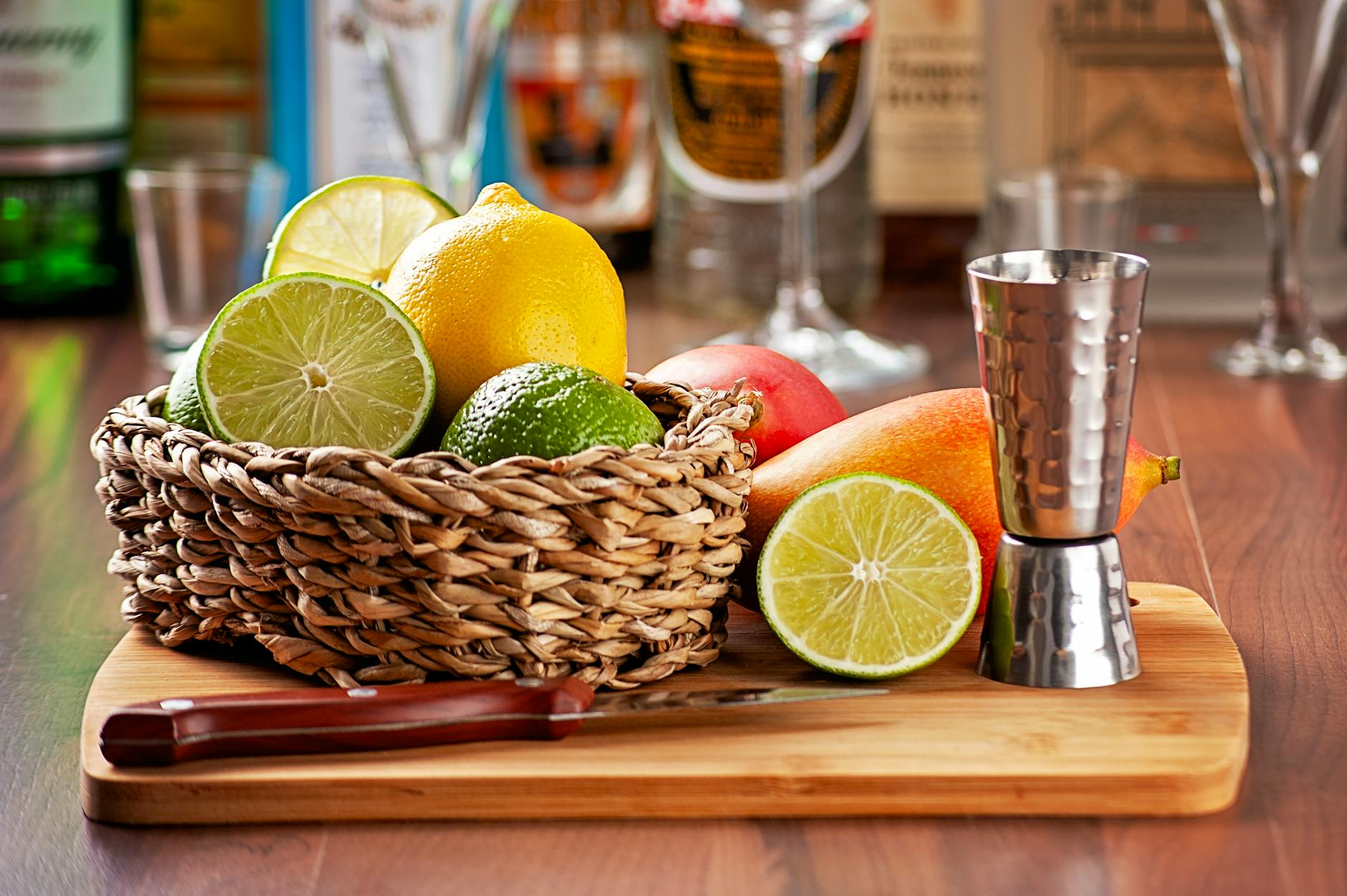 fresh citrus fruits and bar tools on cutting board